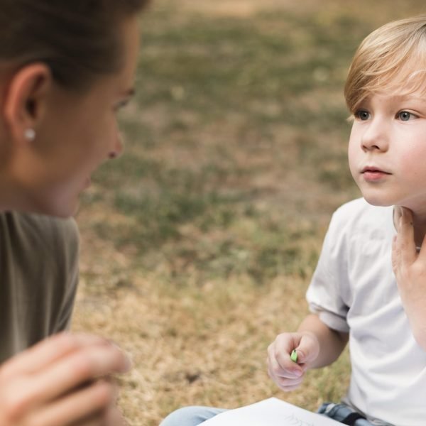 close up teacher boy outdoors